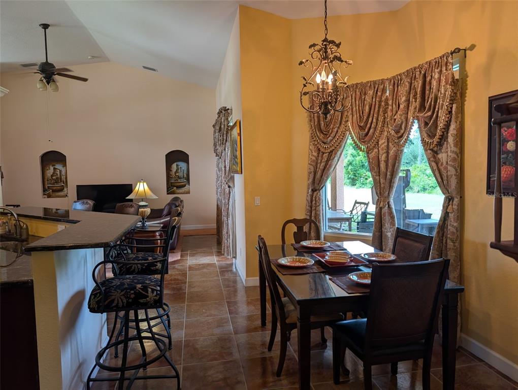 8511 Austrian Boulevard Punta Gorda, FL 33982 - Photo 10 of 20 a view of a dining room with furniture window and outside view