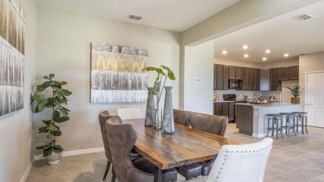 Tbd Southwest 37th Terrace Ocala, FL 34473 - Photo 6 of 22 a view of a dining room with furniture and wooden floor
