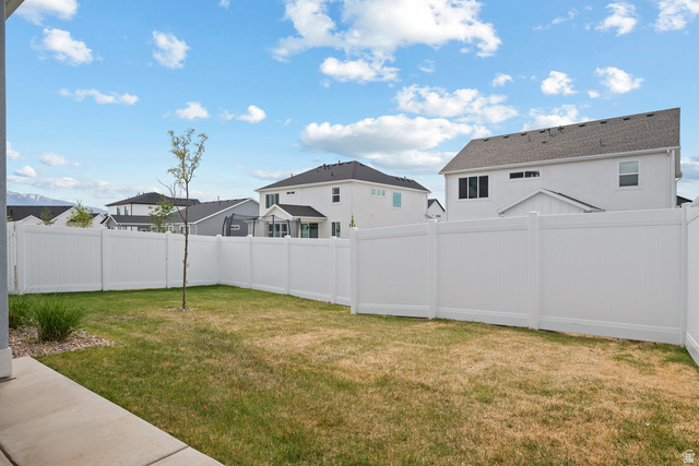 531 North Legend Way West, Unit D Mapleton, UT 84664 - Photo 29 of 42 Fenced backyard with a residential view