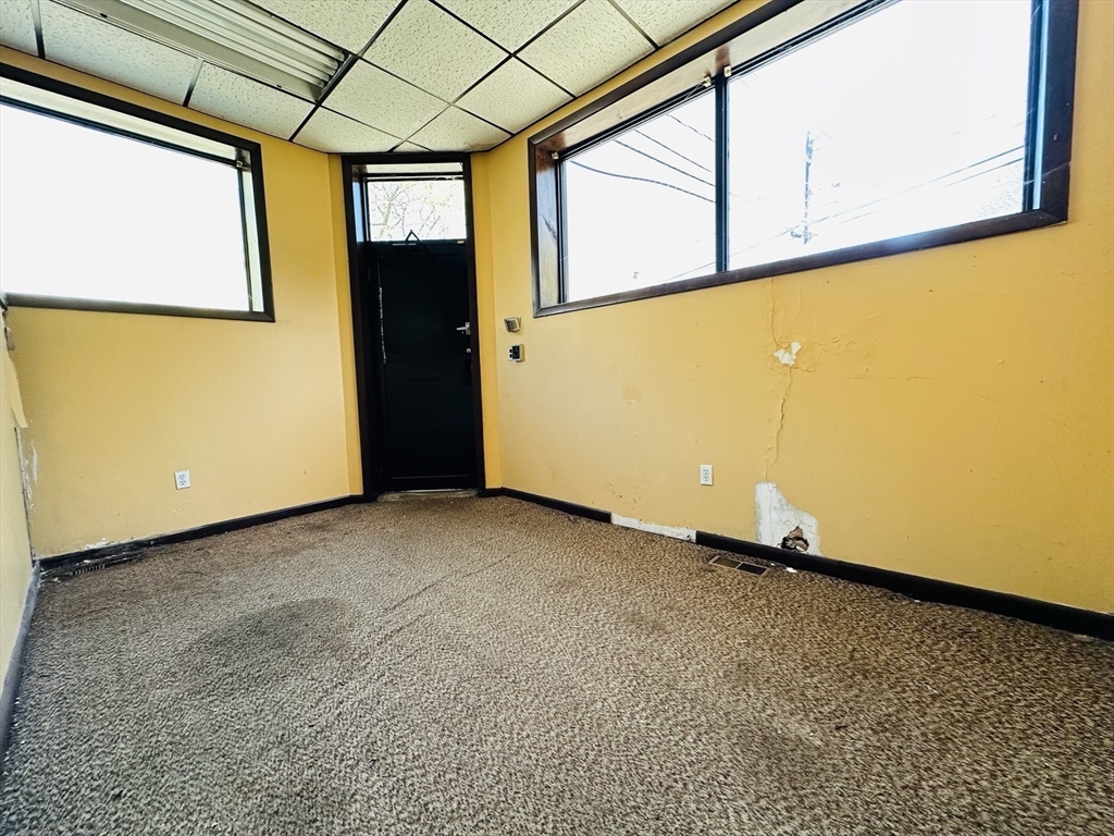 77 Forest Street Watertown, MA 02472 - Photo 6 of 10 a view of a room with painted walls