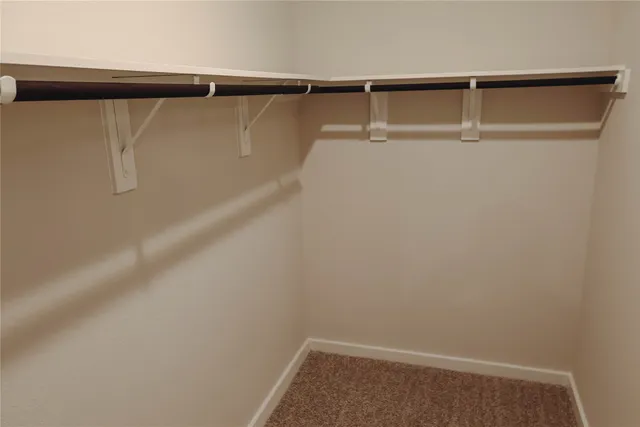 a white toilet sitting next to a bath tub