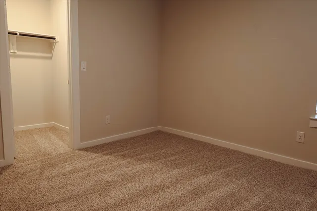 an aerial view of a house with a swimming pool