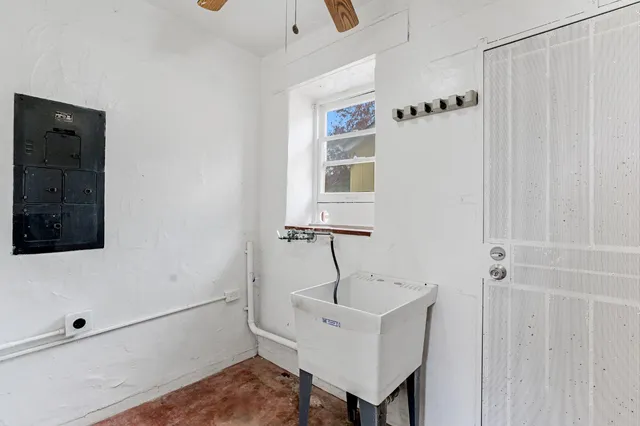 a bathroom with a sink a mirror and shower