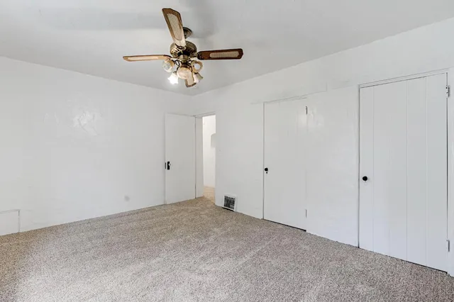 a view of a room with a fan