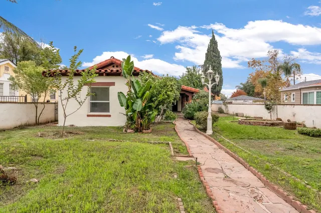 a front view of a house with garden