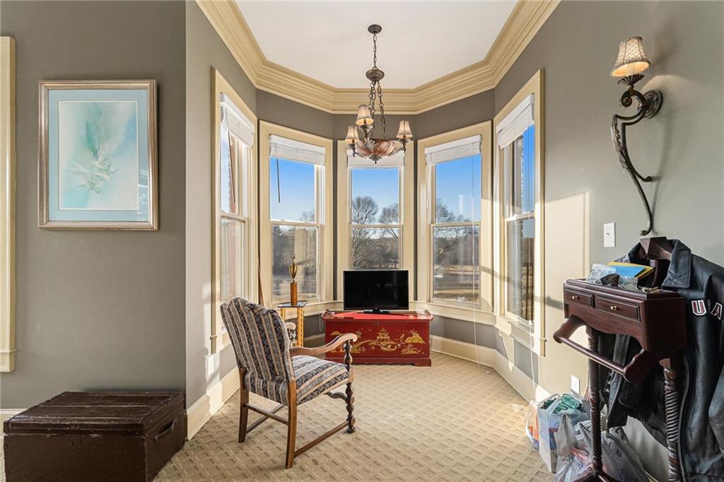 898 Harrison Mill Road Bethlehem, GA 30680 - Photo 11 of 72 a living room with furniture and a chandelier