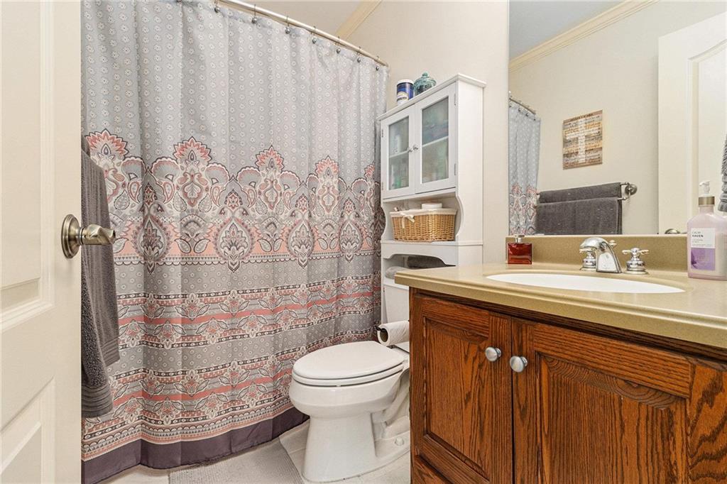 898 Harrison Mill Road Bethlehem, GA 30680 - Photo 20 of 72 a bathroom with a granite countertop sink toilet and shower