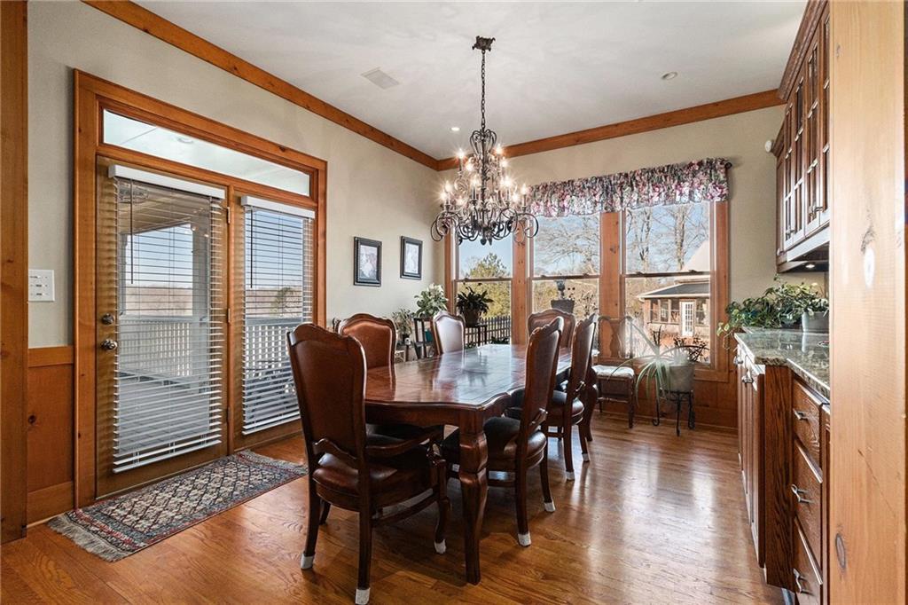 898 Harrison Mill Road Bethlehem, GA 30680 - Photo 36 of 72 a view of a dining room with furniture window and wooden floor