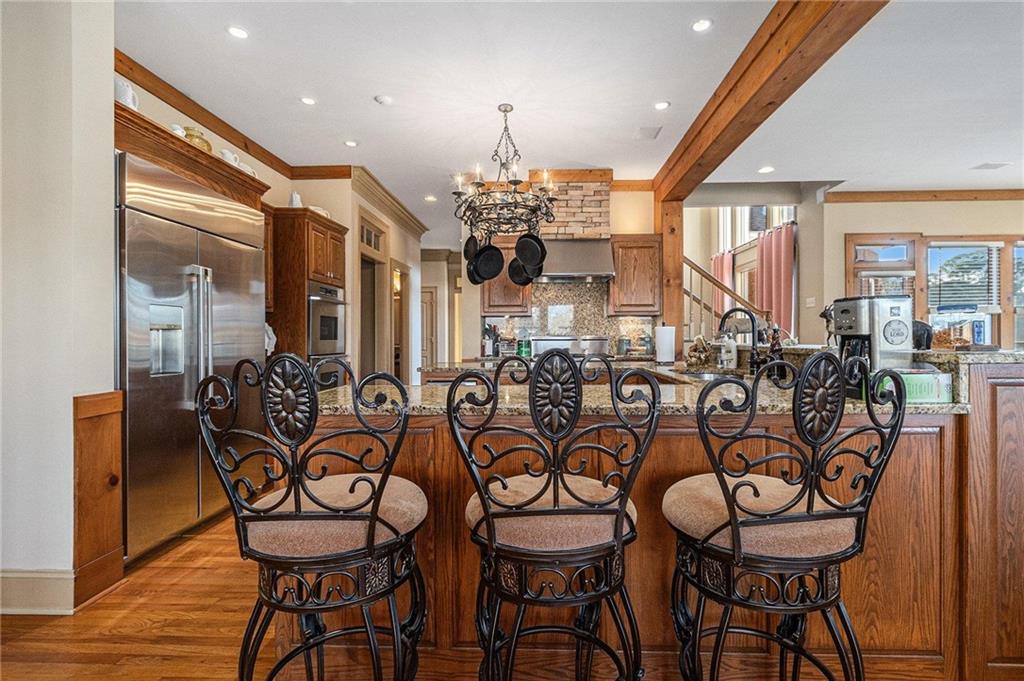 898 Harrison Mill Road Bethlehem, GA 30680 - Photo 37 of 72 a view of a dining room with furniture and chandelier