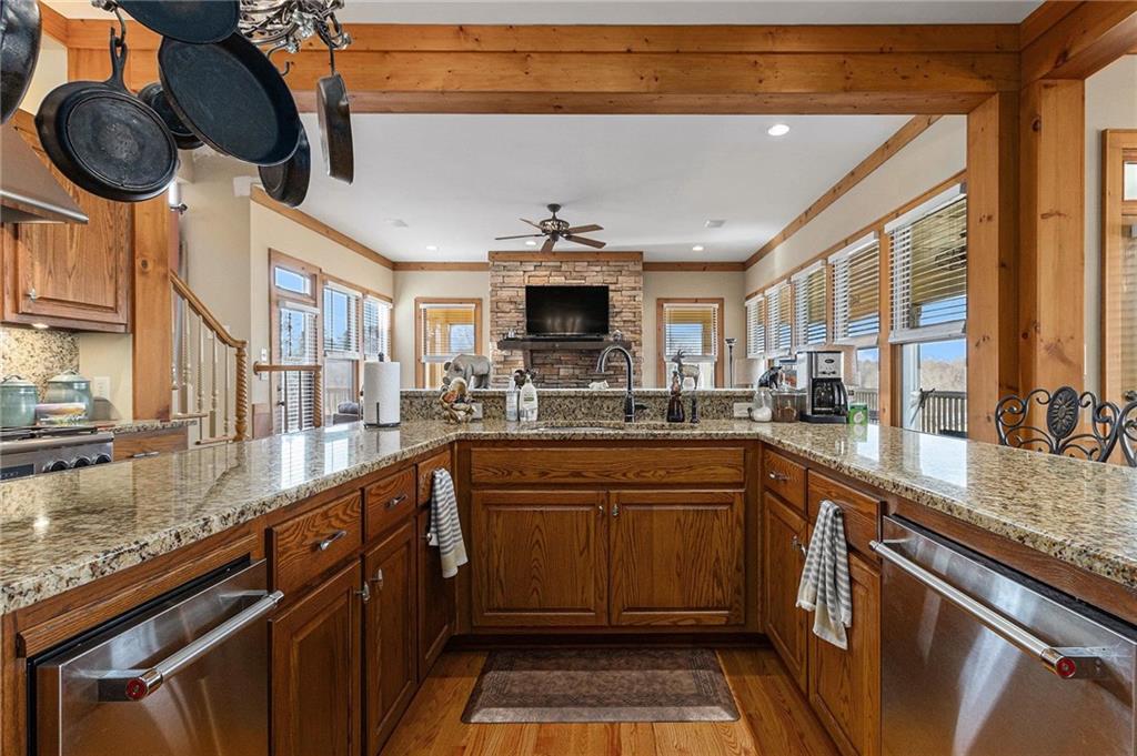 898 Harrison Mill Road Bethlehem, GA 30680 - Photo 38 of 72 a kitchen with stainless steel appliances granite countertop a sink and a stove