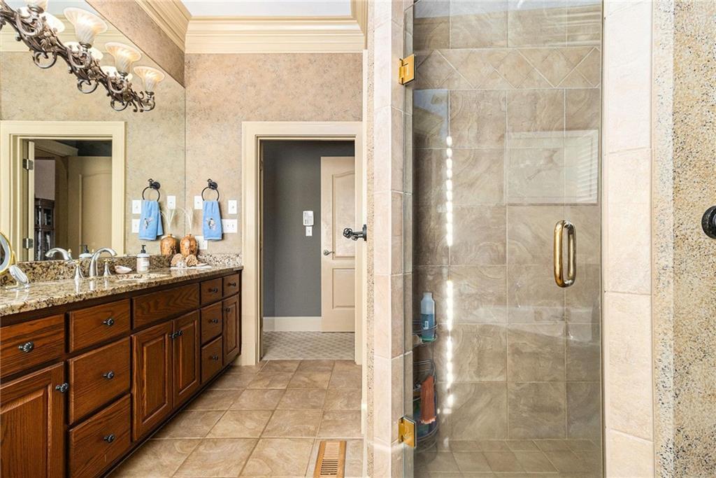 898 Harrison Mill Road Bethlehem, GA 30680 - Photo 56 of 72 a bathroom with a granite countertop shower mirror and a sink