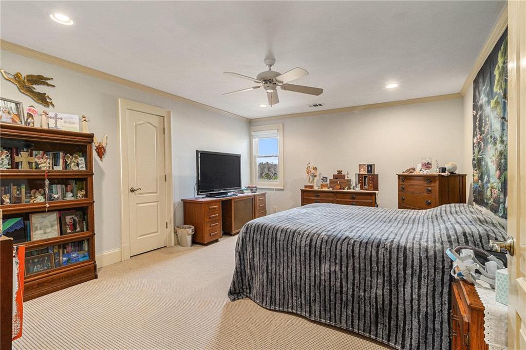 898 Harrison Mill Road Bethlehem, GA 30680 - Photo 61 of 72 a bedroom with a bed and a flat screen tv