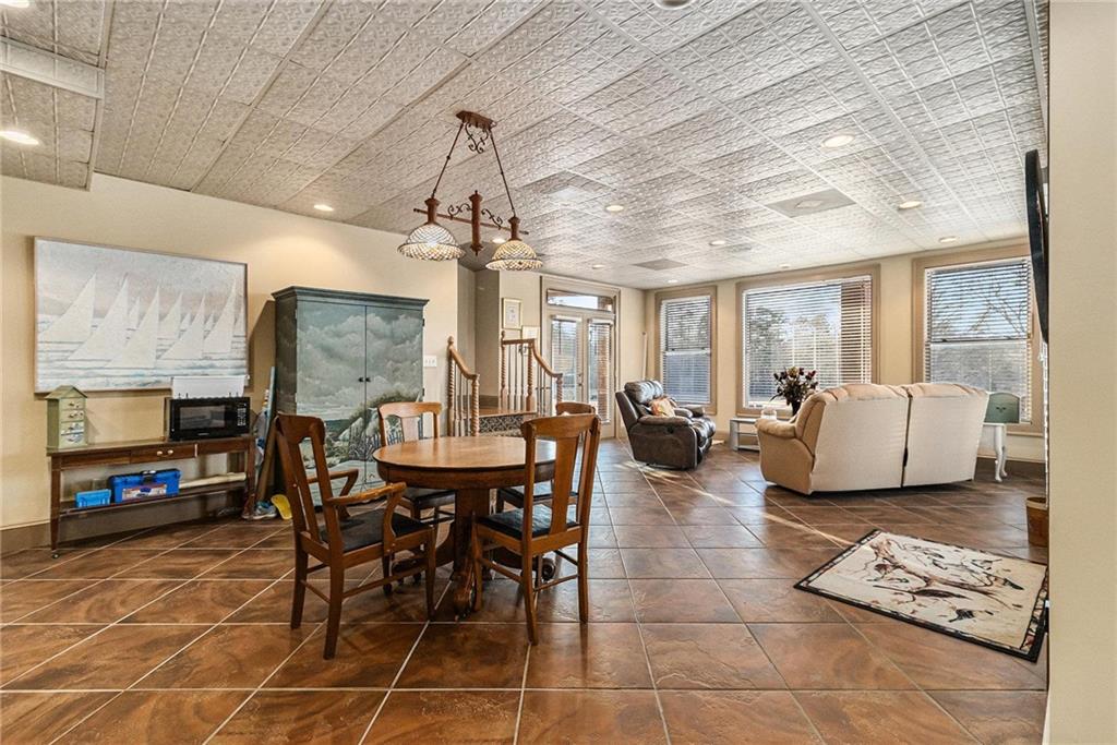 898 Harrison Mill Road Bethlehem, GA 30680 - Photo 71 of 72 a living room with furniture a flat screen tv and a dining table