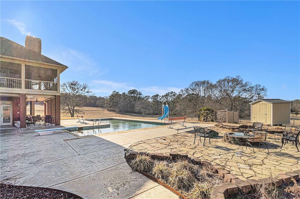 898 Harrison Mill Road Bethlehem, GA 30680 - Photo 9 of 72 a view of a swimming pool with an outdoor seating