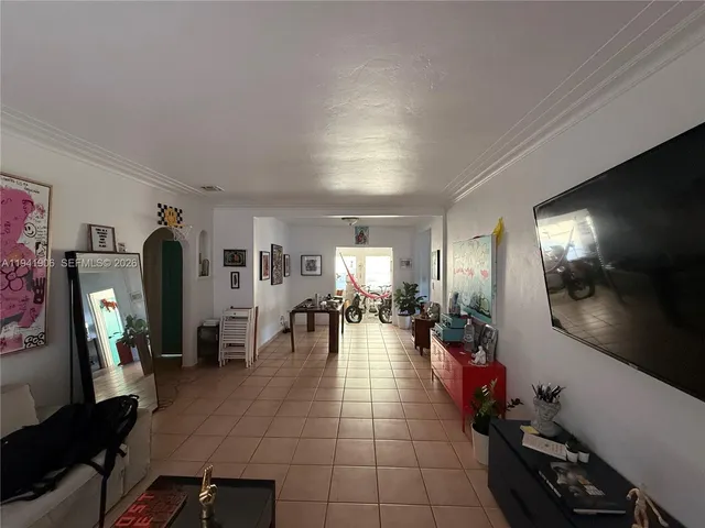 a lobby with furniture and floor to ceiling window