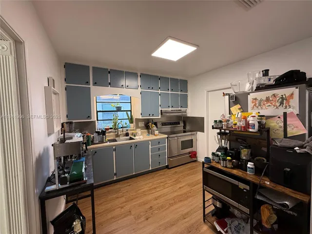 a kitchen with lots of counter top space and appliances