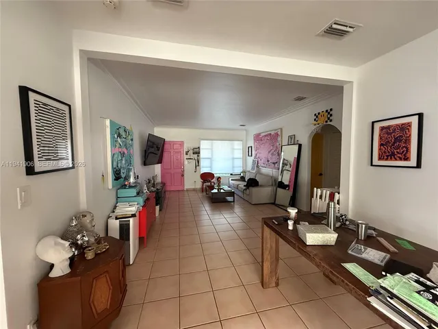 a living room with furniture chess board and a table