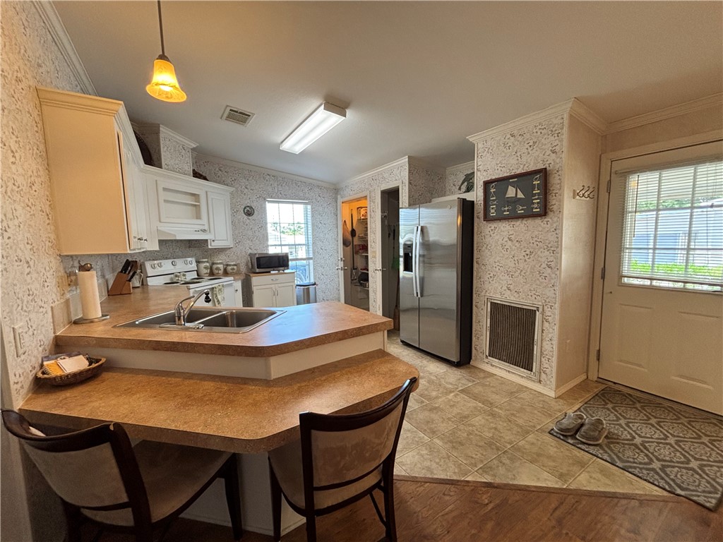 6171 98th Road Sebastian, FL 32958 - Photo 7 of 14 a view of a dining room with furniture