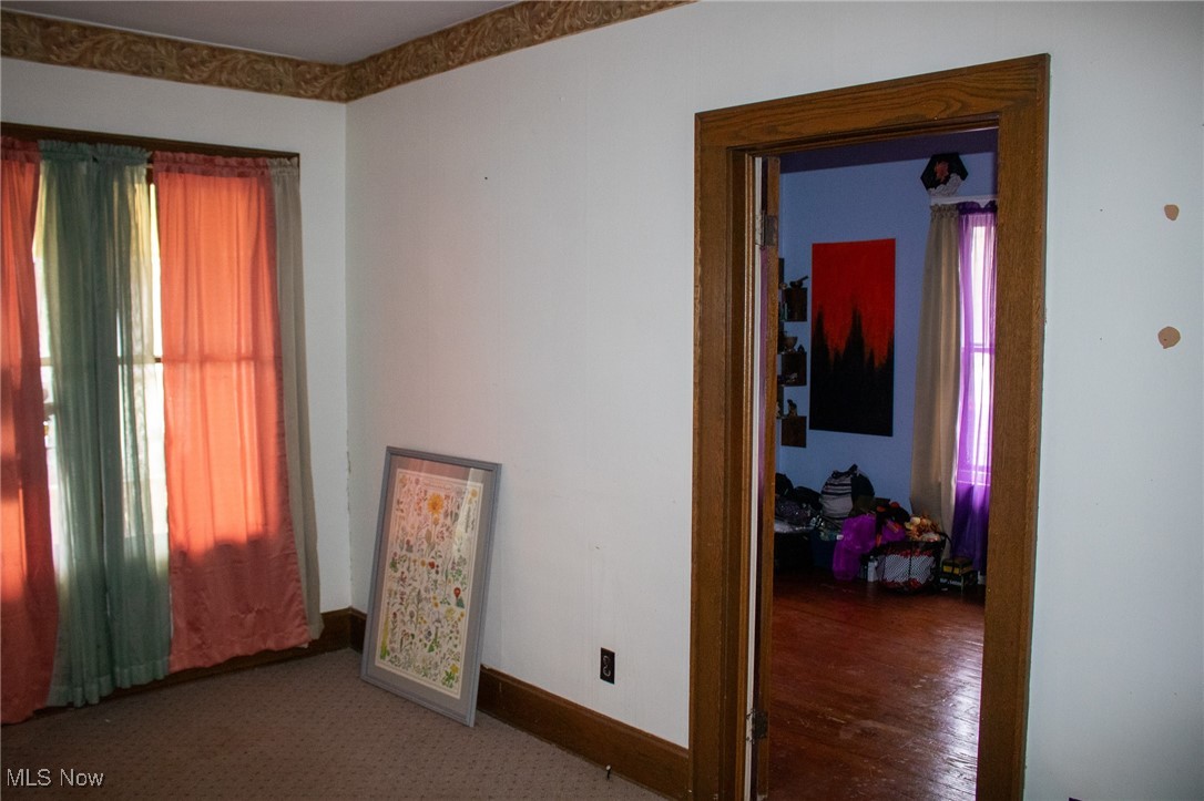 1900 Maple Road Cambridge, OH 43725 - Photo 27 of 45 Spare room with wood-type flooring