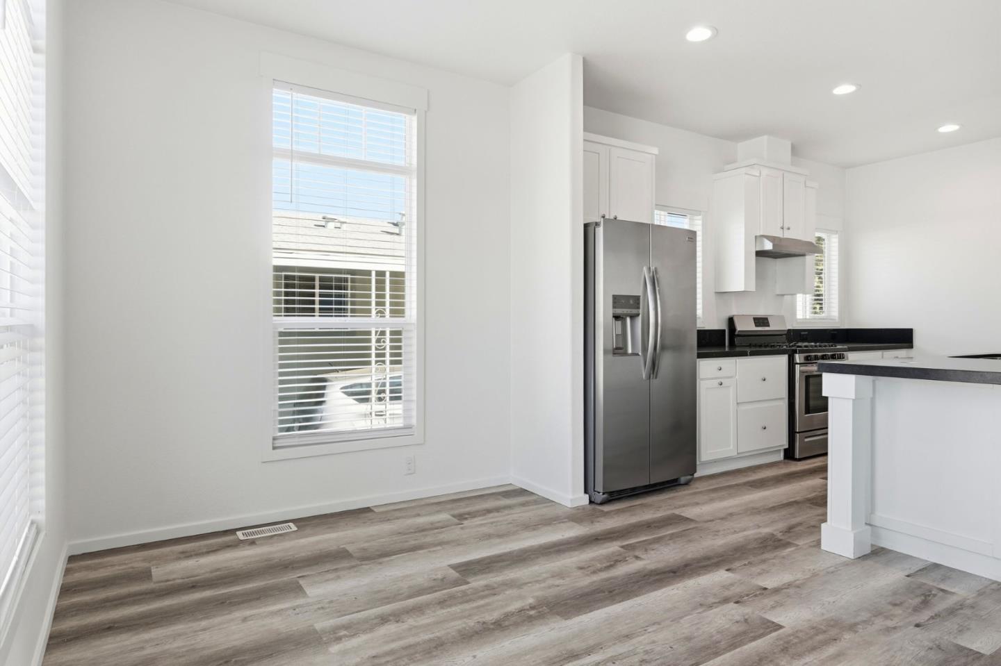 500 West 10th Street, Unit 140 Gilroy, CA 95020 - Photo 14 of 35 a view of a kitchen with a sink a refrigerator and window