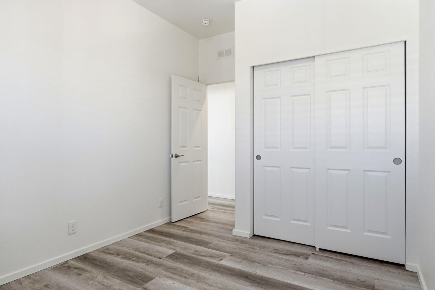 500 West 10th Street, Unit 140 Gilroy, CA 95020 - Photo 17 of 35 an empty room with wooden floor