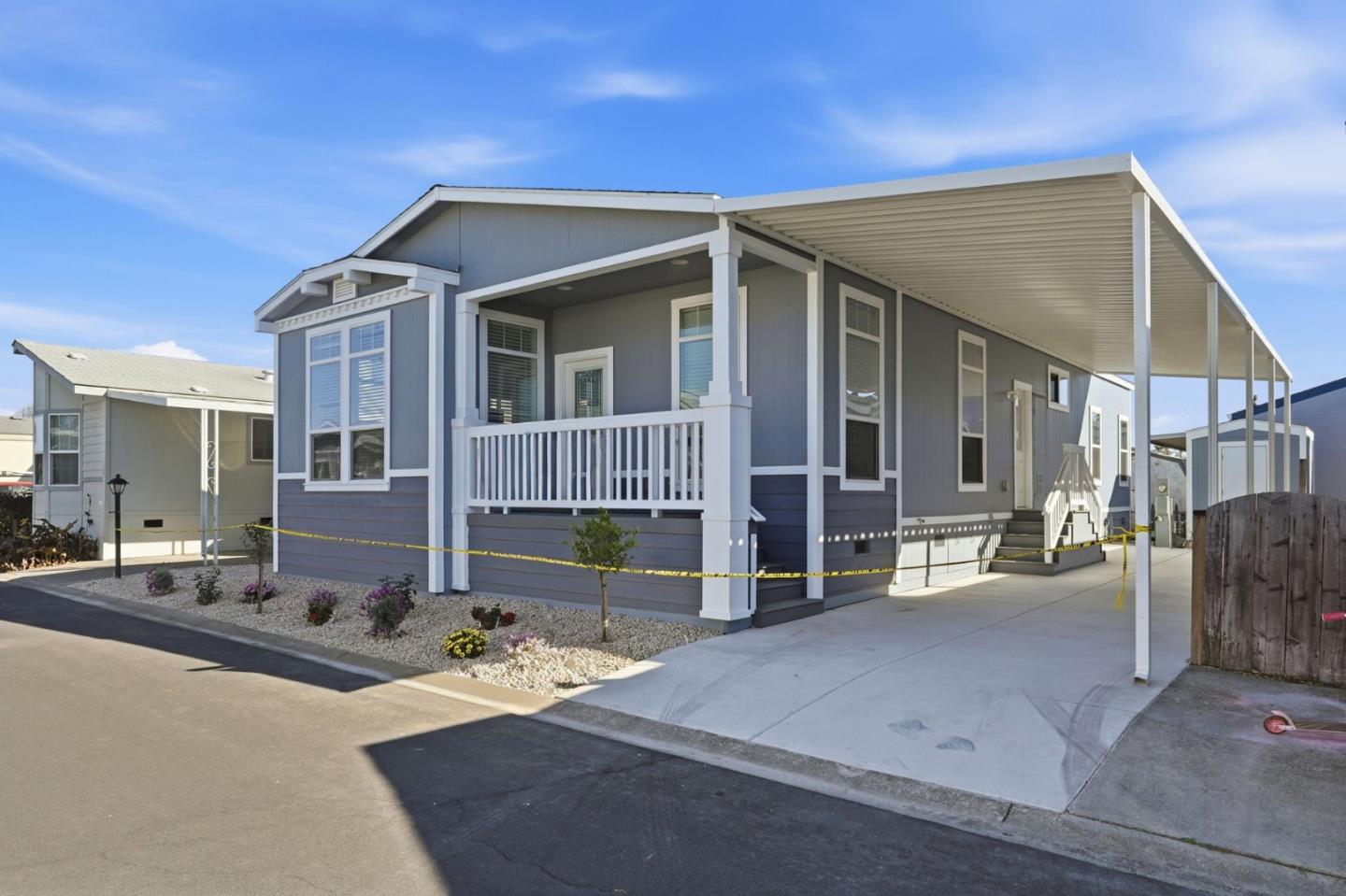 500 West 10th Street, Unit 140 Gilroy, CA 95020 - Photo 3 of 35 a front view of a house with a yard