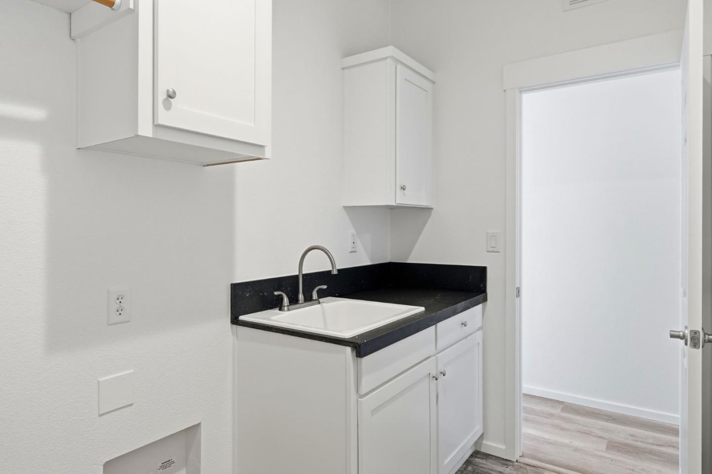 500 West 10th Street, Unit 140 Gilroy, CA 95020 - Photo 31 of 35 a kitchen with a sink and cabinets