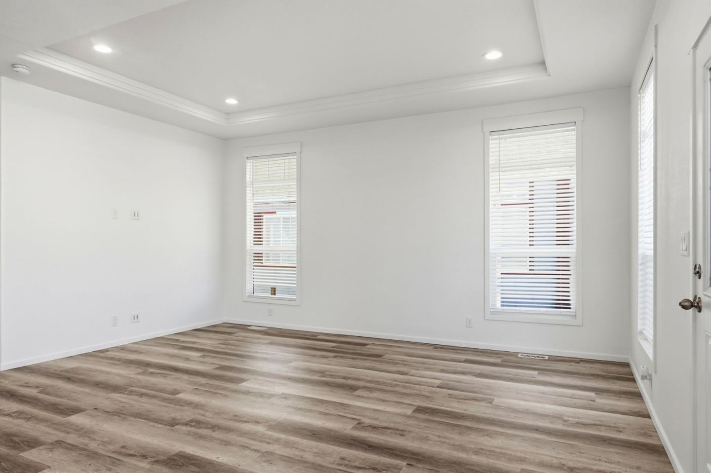 500 West 10th Street, Unit 140 Gilroy, CA 95020 - Photo 5 of 35 a view of empty room with wooden floor and fan