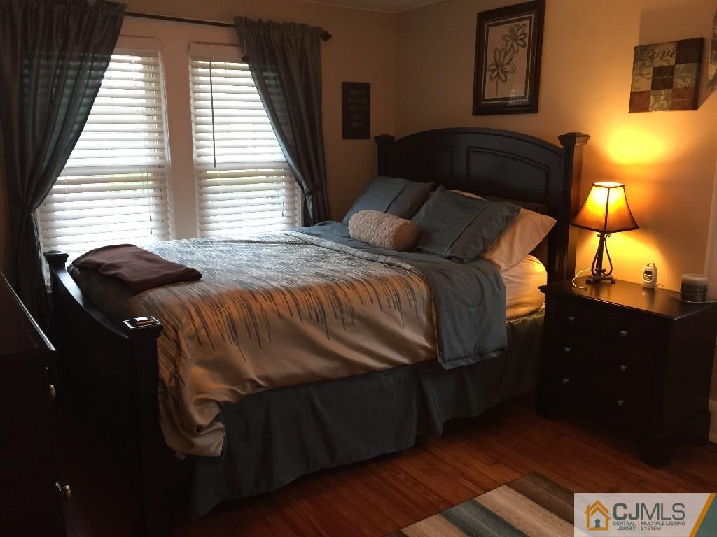 62 Greenbrook Road Middlesex, NJ 08846 - Photo 14 of 24 a bedroom with a bed and lamps