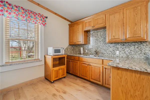 a very nice looking kitchen with a large window