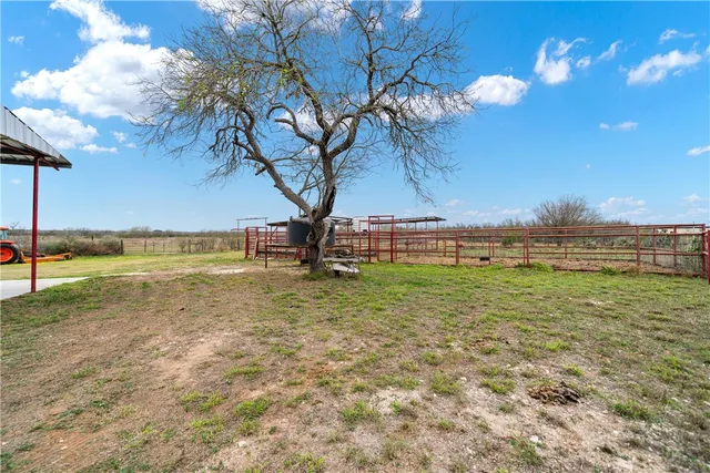 a view of a backyard with sitting area