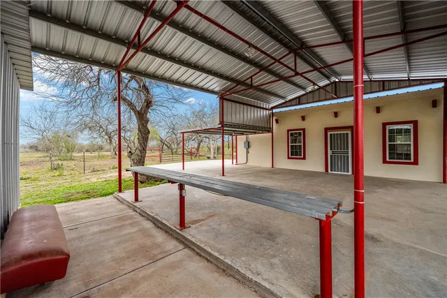 a view of a terrace with a garden and deck