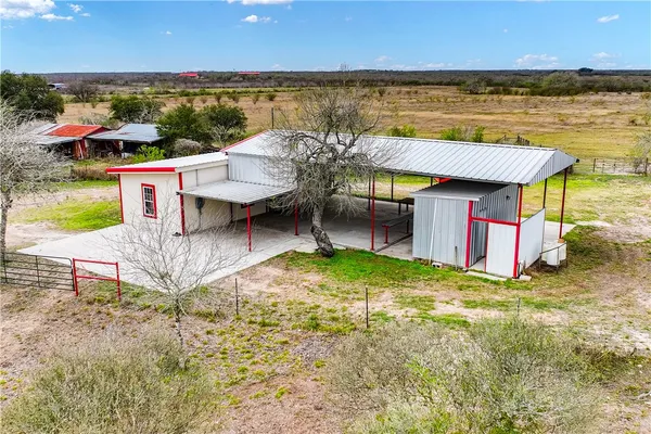 an aerial view of a house with a garden and outdoor space