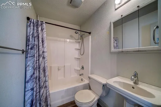 a bathroom with a shower and a bath tub