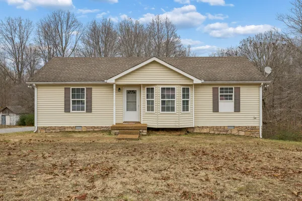 a house with trees in the background