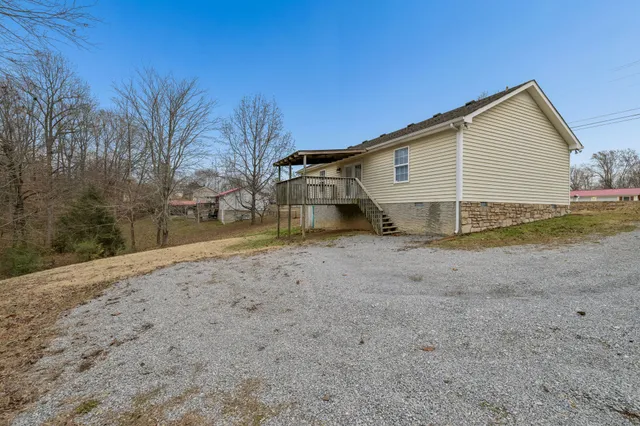 a view of a house with a yard and garage