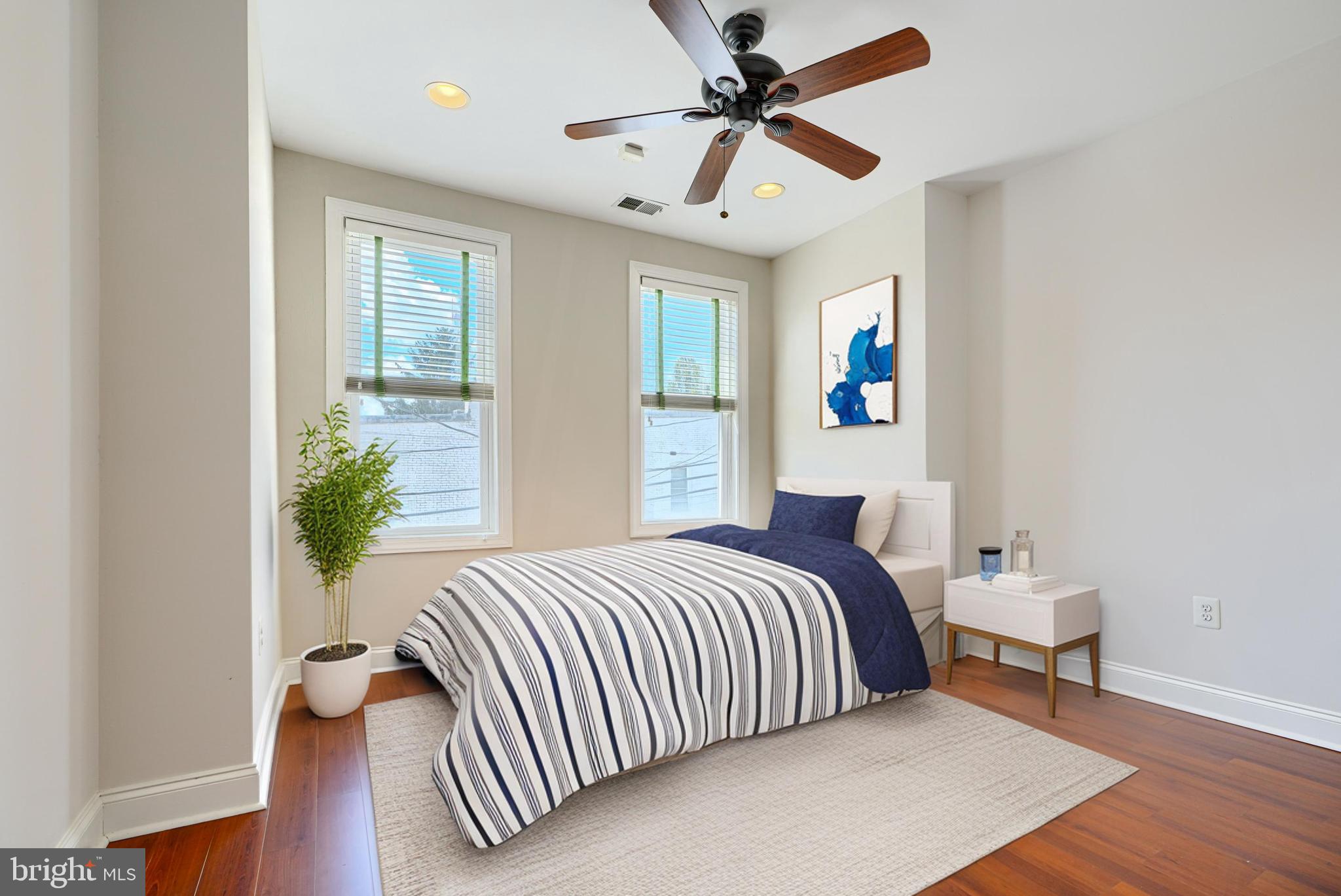 4126 Falls Road Baltimore, MD 21211 - Photo 18 of 35 a bedroom with a bed and a window