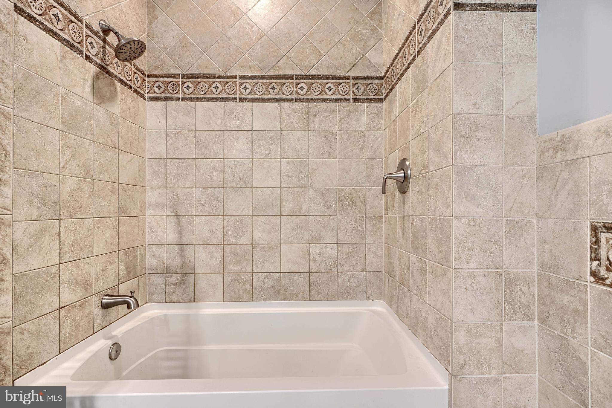 4126 Falls Road Baltimore, MD 21211 - Photo 24 of 35 a bathroom with a bathtub