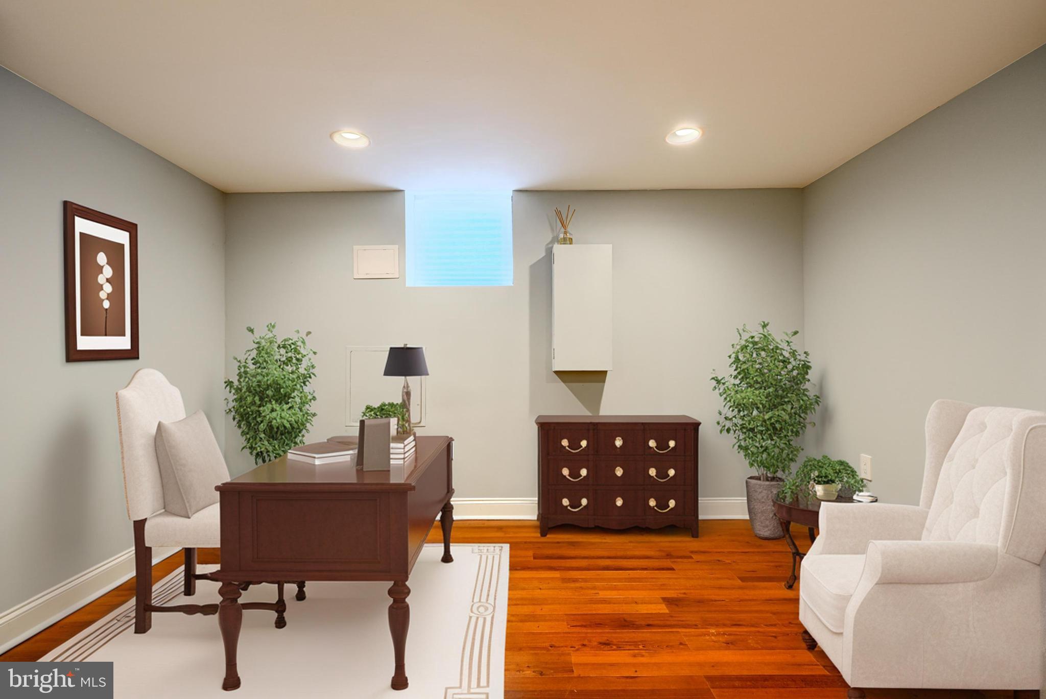 4126 Falls Road Baltimore, MD 21211 - Photo 31 of 35 a living room with furniture and a wooden floor