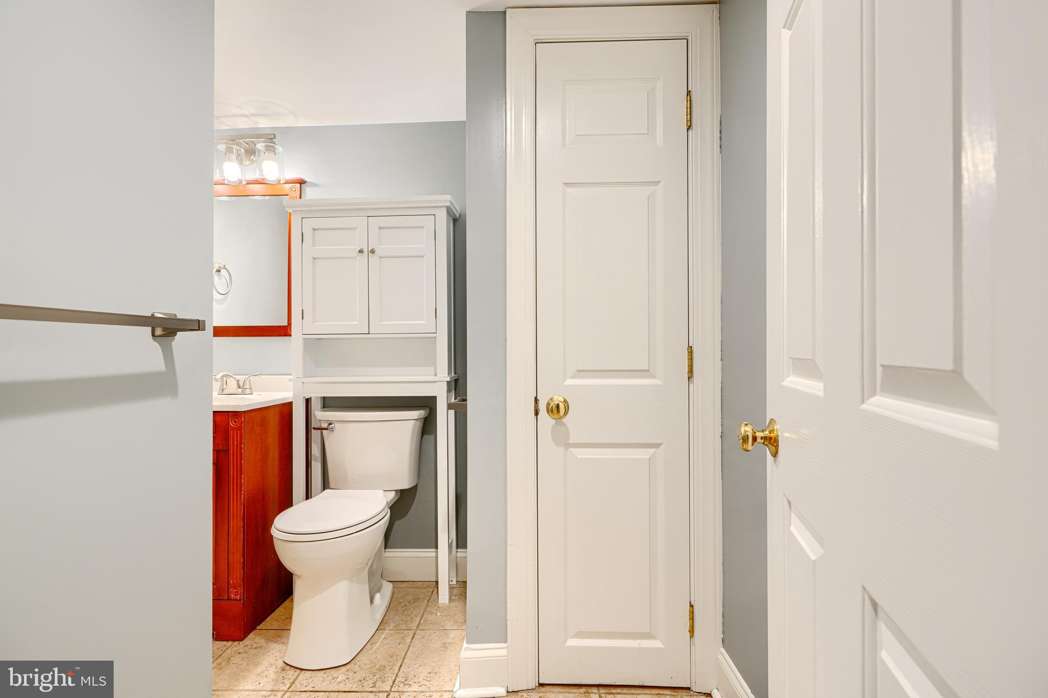 4126 Falls Road Baltimore, MD 21211 - Photo 35 of 35 a white toilet sitting next to a bathroom sink