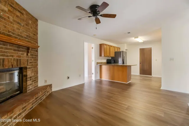 a view of a kitchen with a sink and a stove top oven