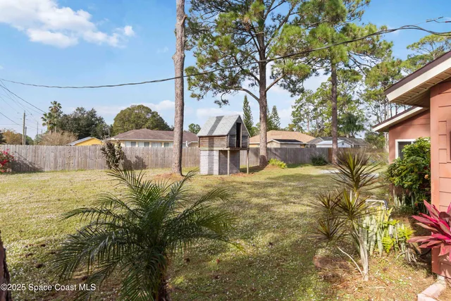 a view of a yard with an outdoor seating