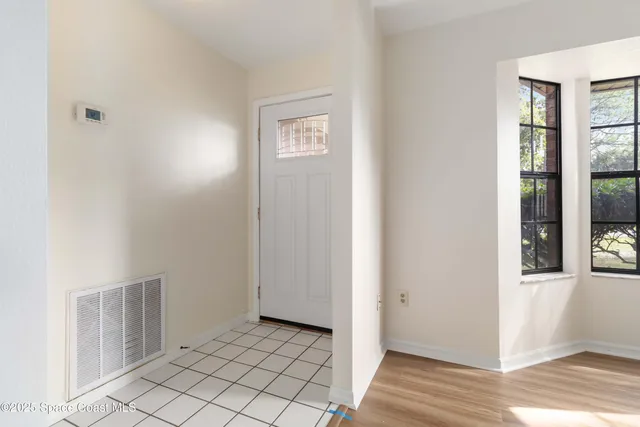 a view of an empty room and window