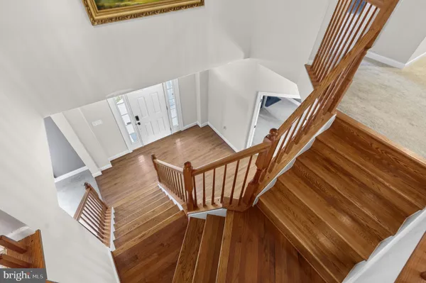 a view of an empty room with stairs