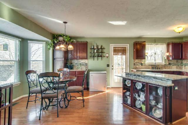106 Pheasant Hollow Road Dickson, TN 37055 - Photo 6 of 19 Very spacious kitchen with lovely island & extra cabinets looking out the bay window