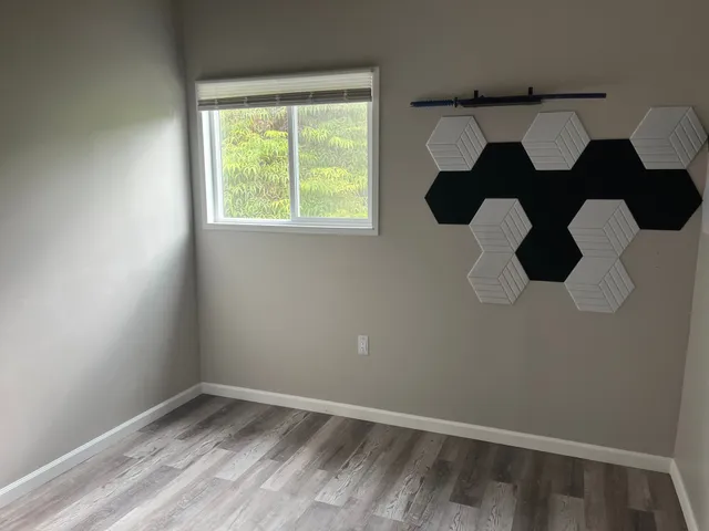 a bathroom with a sink mirror vanity and toilet