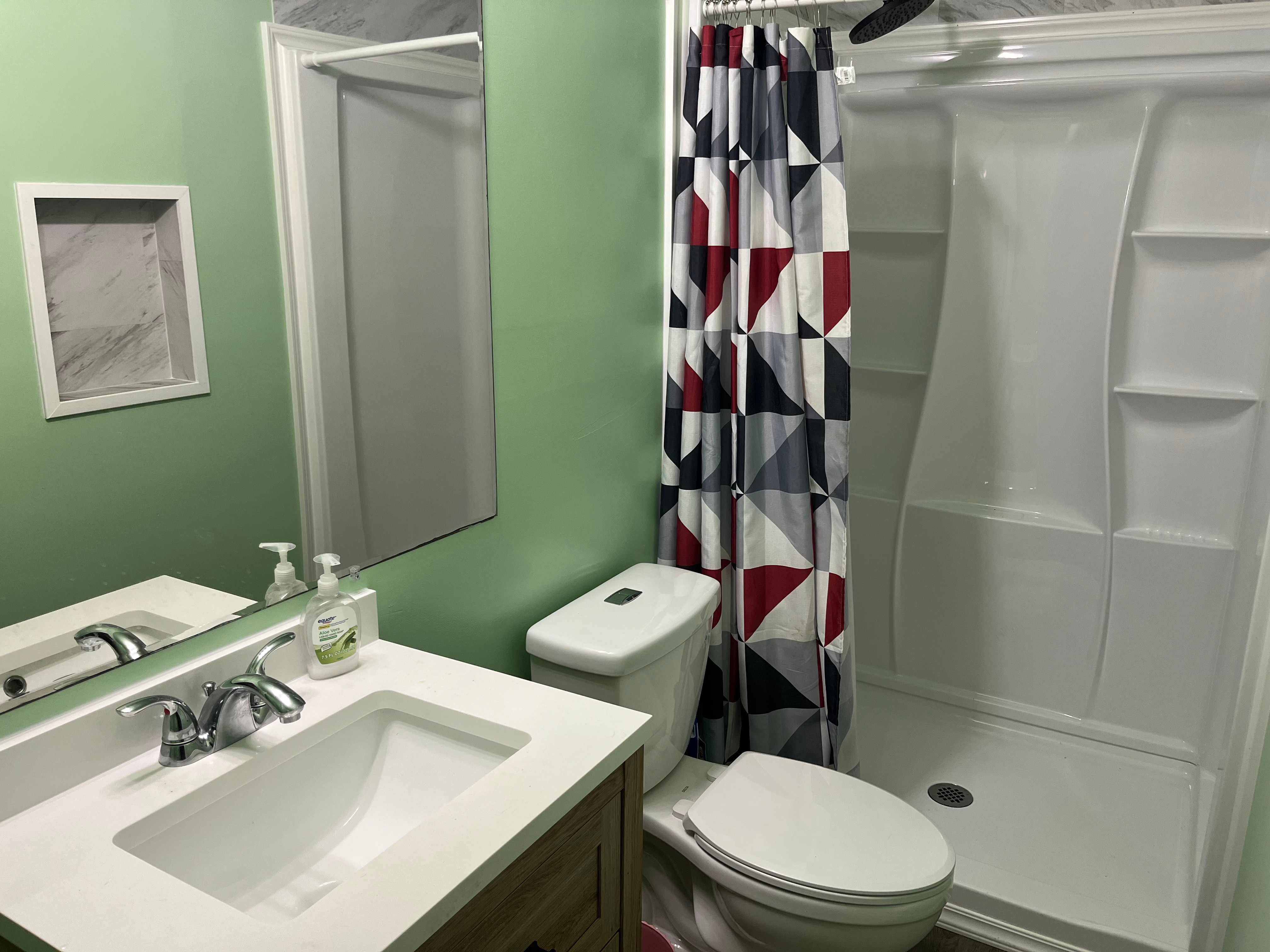 14-3475 Tutu Lane Pahoa, HI 96778 - Photo 17 of 26 a bathroom with a sink mirror vanity and toilet