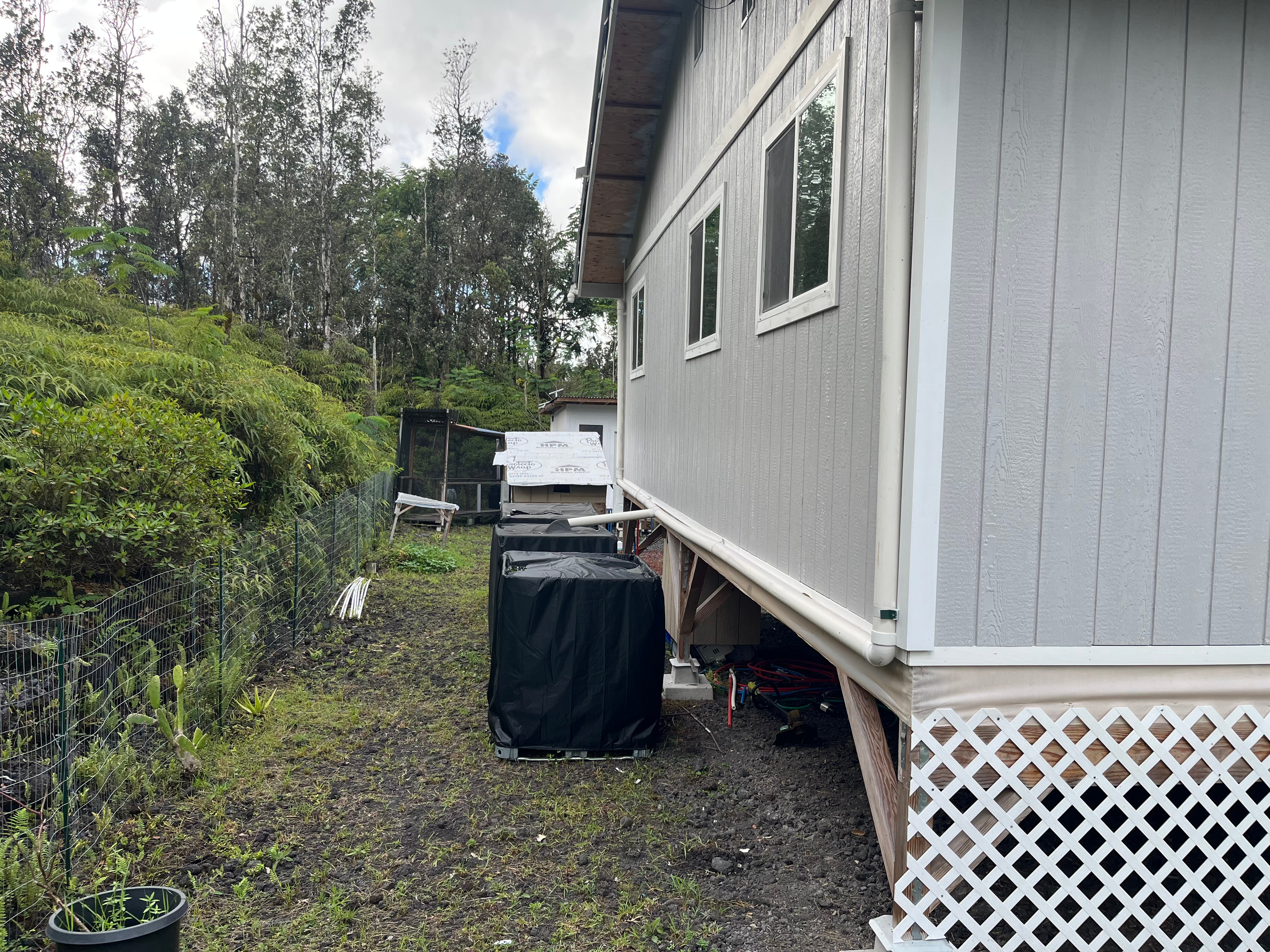 14-3475 Tutu Lane Pahoa, HI 96778 - Photo 24 of 26 a backyard of a house with lots of green space