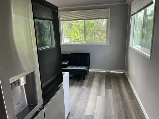 a kitchen with a sink cabinets and window