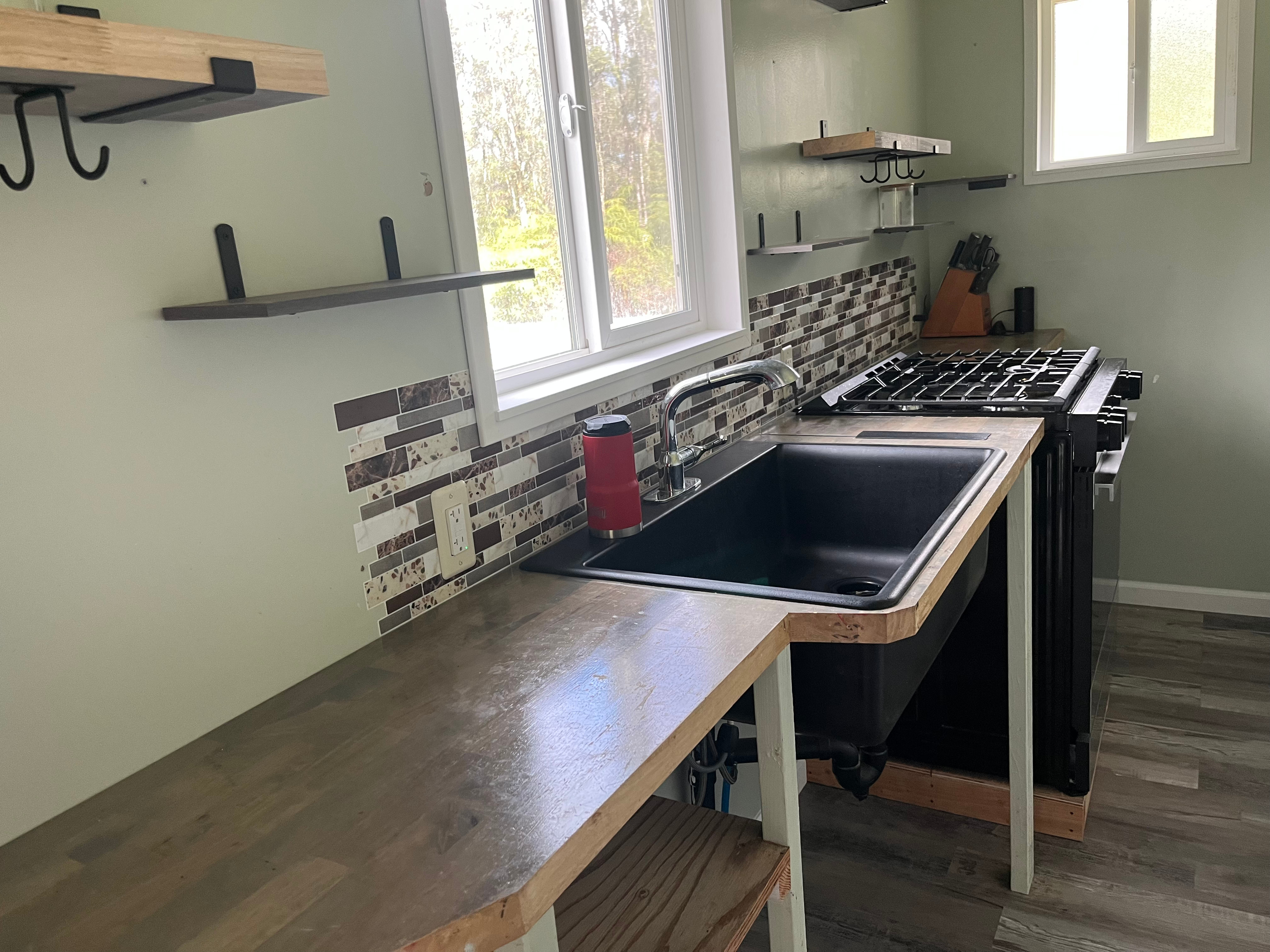 14-3475 Tutu Lane Pahoa, HI 96778 - Photo 5 of 26 a kitchen with a sink cabinets and window